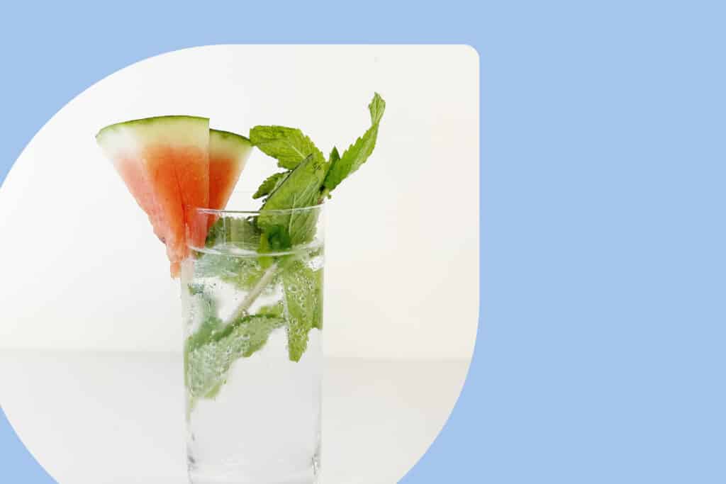 Watermelon mojito with watermelon wedge garnish