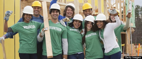 Group of volunteers working on a house