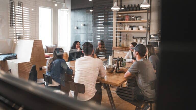 Group of people enjoying drinks in the company kitchen