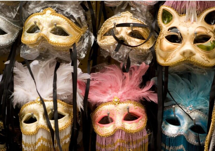 Two rows of fancy costume ball masks