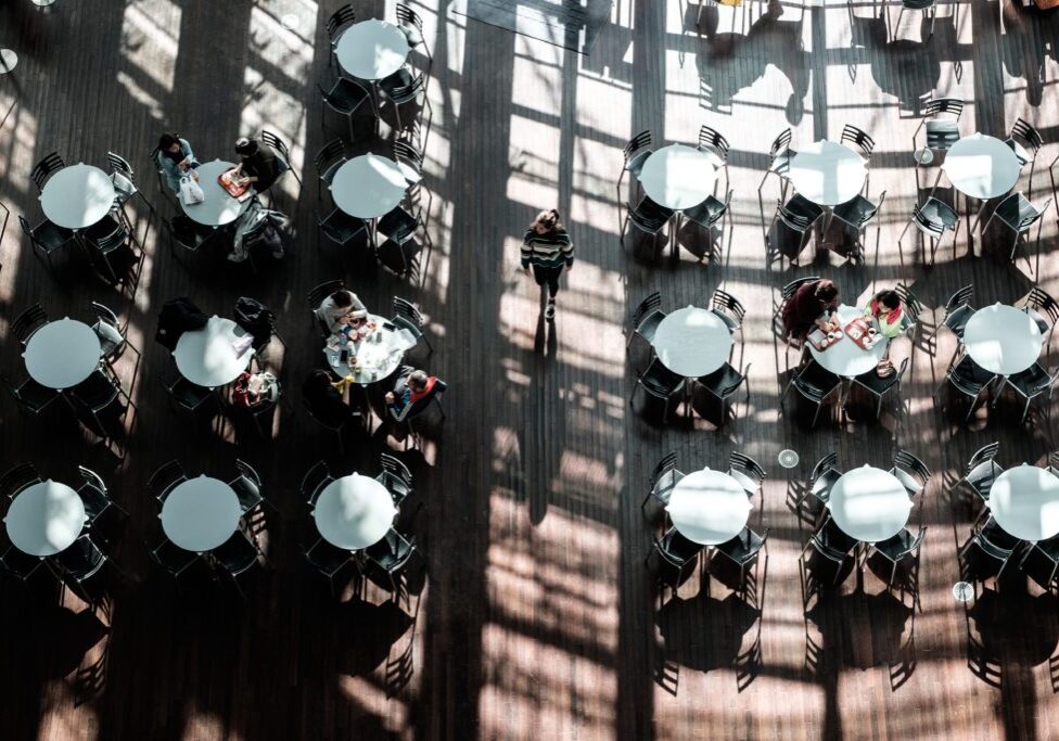 Overhead view of several tables and chairs in an outdoor dining area