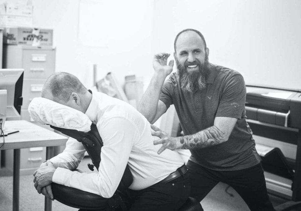 A man getting a massage at work