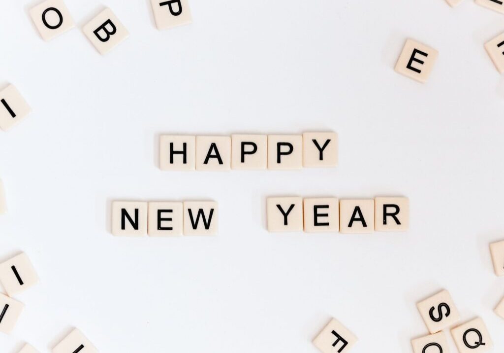 Scrabble pieces spelling out "Happy New Year"